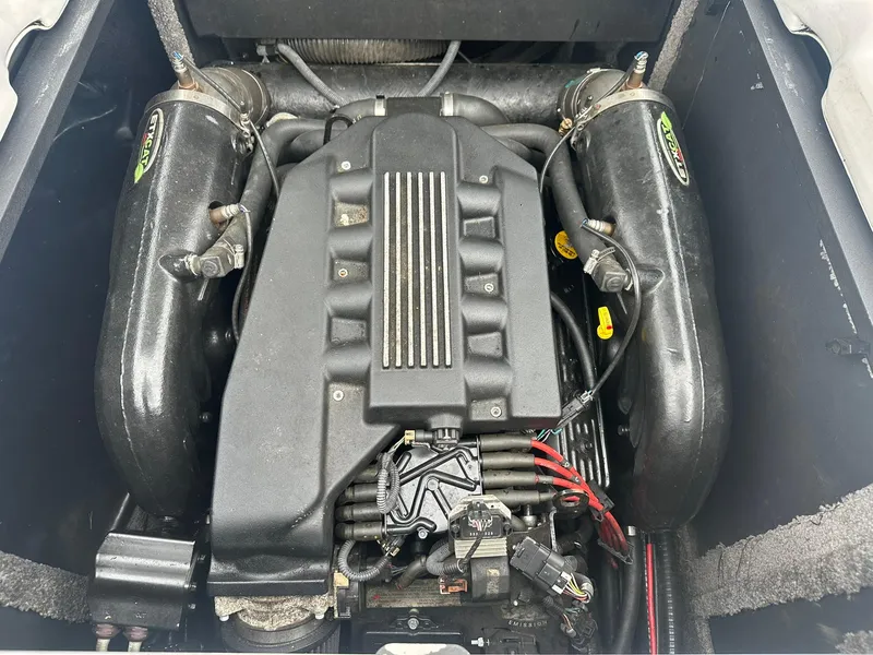 Slide: The Image of 2009 Supra Launch 22 SSV engine compartment showcasing powerful inboard motor components. - 18