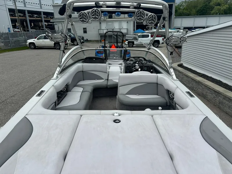 Slide: The Image of 2009 Supra Launch 22 SSV boat interior with gray seating and sound system. - 6