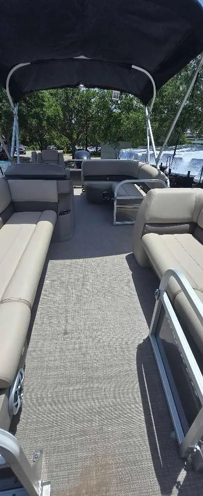 Slide: The Image of 2025 Sun Tracker Party Barge 18 DLX pontoon boat with spacious seating and canopy. - 3