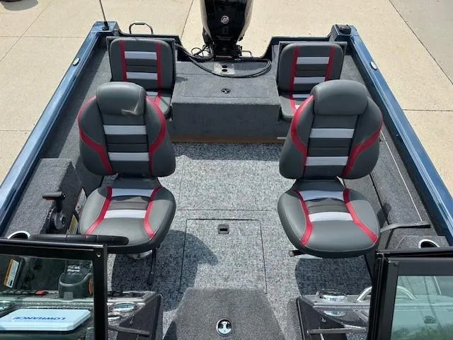 Slide: The Image of 2025 Ranger VS1782SC Reata boat interior with four gray and red seats. - 7