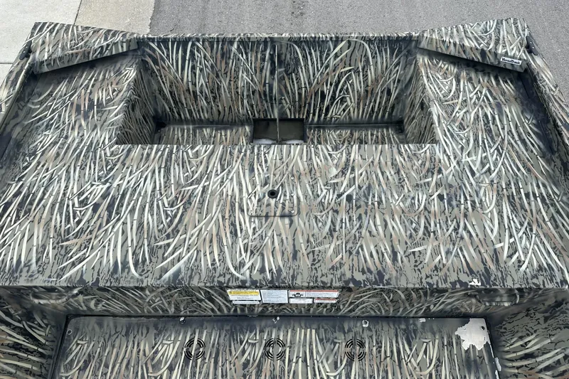 Slide: The Image of 2025 Tracker Grizzly 1860 Utility boat with camouflage pattern on deck. - 26