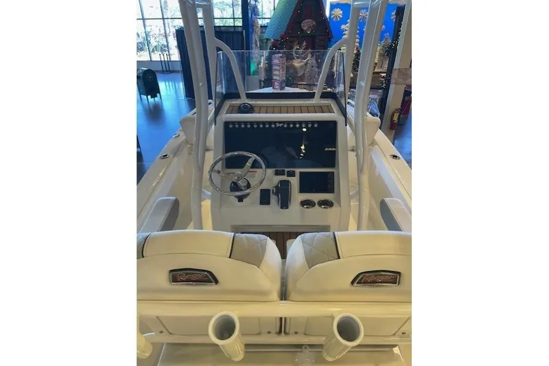 Slide: The Image of 2025 Ranger 2510 Bay boat interior with steering console and seating. - 3