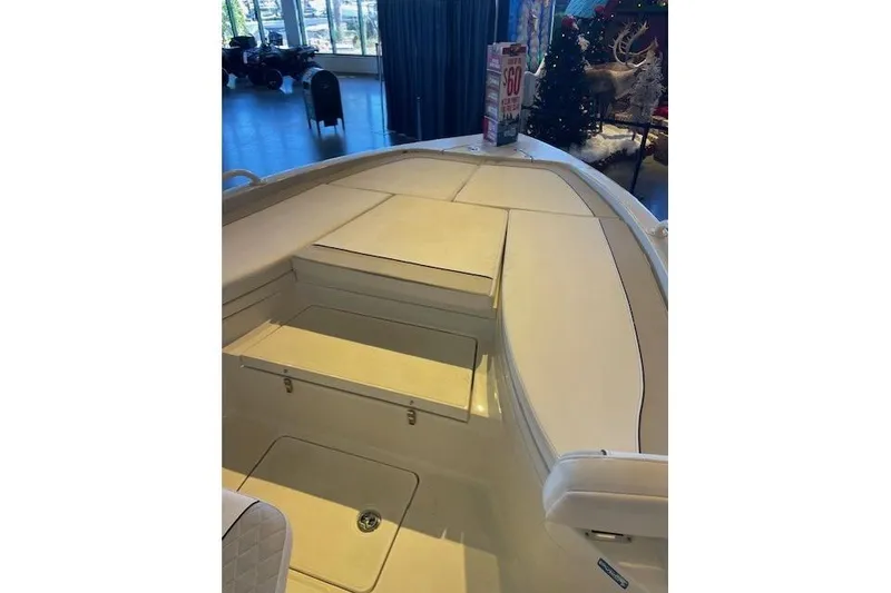 Slide: The Image of 2025 Ranger 2510 Bay boat interior with seating and storage compartments. - 4