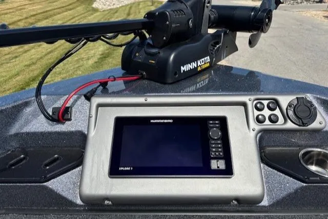 Slide: The Image of 2025 Ranger 1850MS boat interior with blue seats, steering console, and modern dashboard. - 3