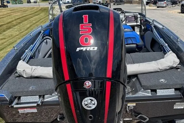 Slide: The Image of 2025 Ranger 1850MS boat with powerful 150 HP outboard motor, parked outdoors. - 6