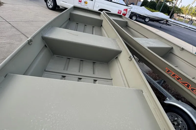 The Image of 2025 Tracker Grizzly 12 Jon boat on trailer, parked outdoors. - 0