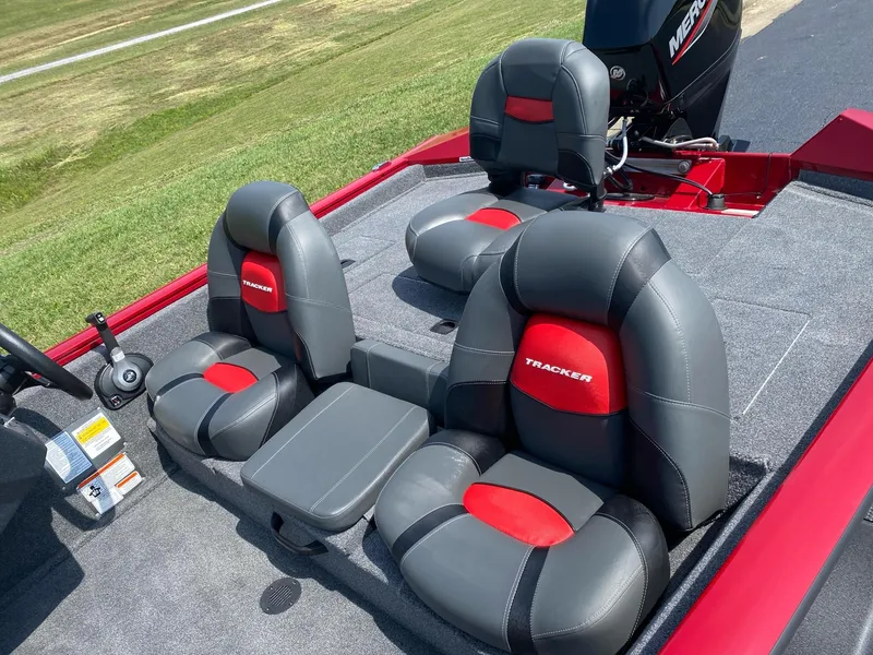Slide: The Image of 2025 Tracker Pro Team 175 boat interior with gray and red seating. - 5