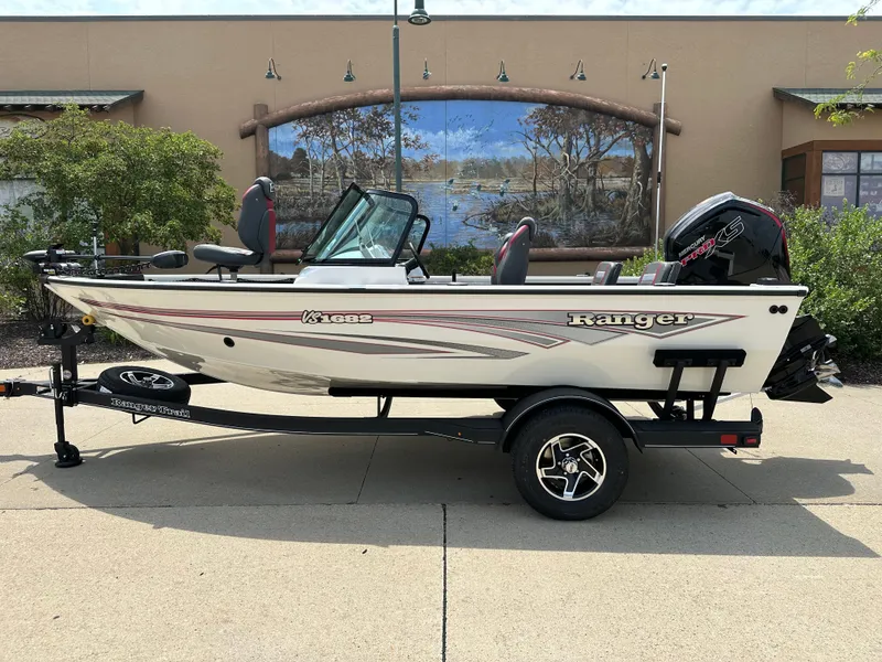 Slide: The Image of 2025 Ranger VS1682SC Reata boat on trailer, parked outdoors. - 0
