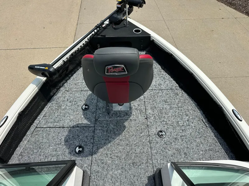 Slide: The Image of 2025 Ranger VS1682SC Reata boat interior with gray carpet and central seat. - 4