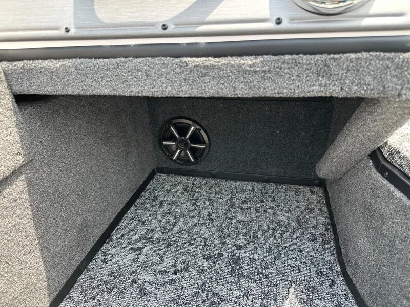 Slide: The Image of 2025 Ranger VS1682SC Reata interior with carpeted storage and speaker. - 6