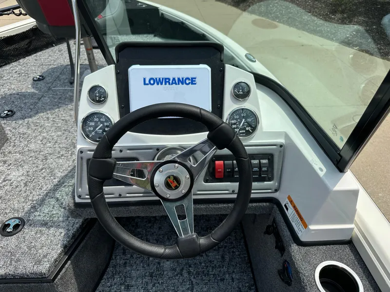 Slide: The Image of 2025 Ranger VS1682SC Reata boat dashboard with Lowrance display and steering wheel. - 7