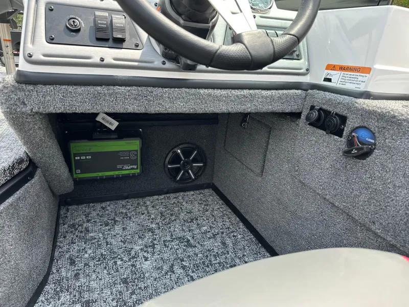 Slide: The Image of 2025 Ranger VS1682SC Reata boat interior with steering wheel and control panel. - 8