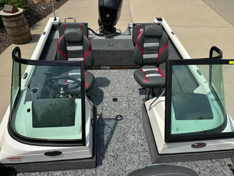 Slide: The Image of 2025 Ranger VS1682SC Reata boat interior with dual seats and steering console. - 9