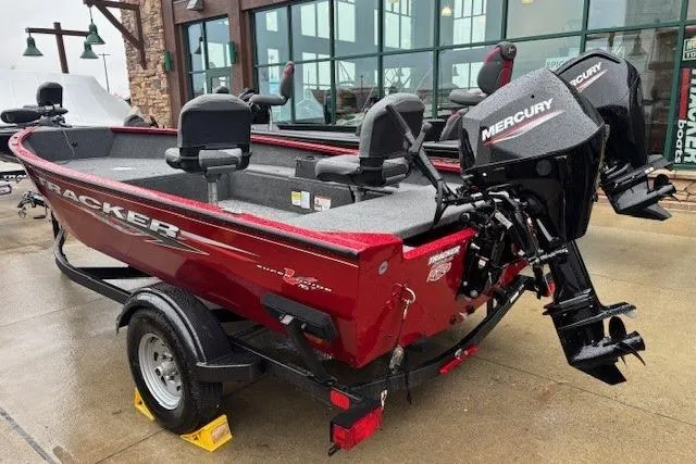 The Image of 2025 Tracker Super Guide V-16 T boat with Mercury engine, parked outdoors. - 0