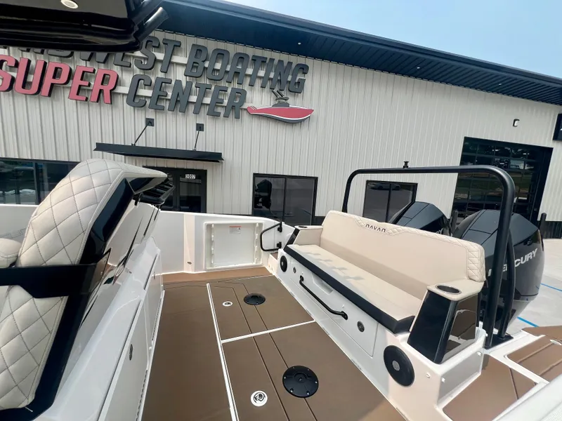 Slide: The Image of 2025 Navan S-30 boat interior at dealership, featuring seating and modern design. - 11