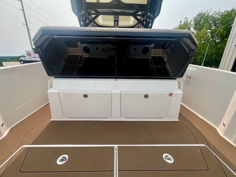 Slide: The Image of 2025 Navan S-30 boat storage compartments with open lid, showcasing spacious interior design. - 15