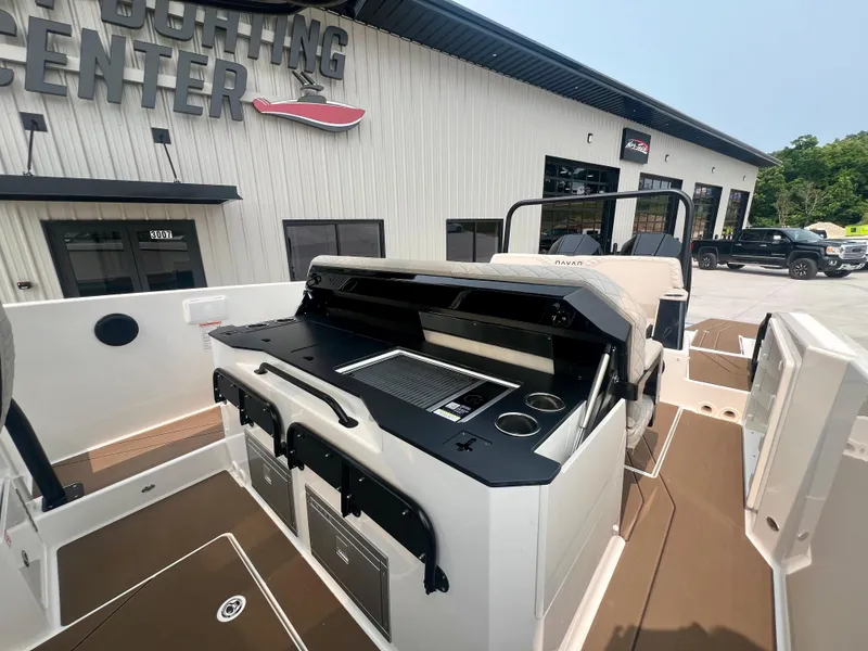 Slide: The Image of Navan S-30 boat interior with modern console, docked at a sporting center, 2025 model. - 18