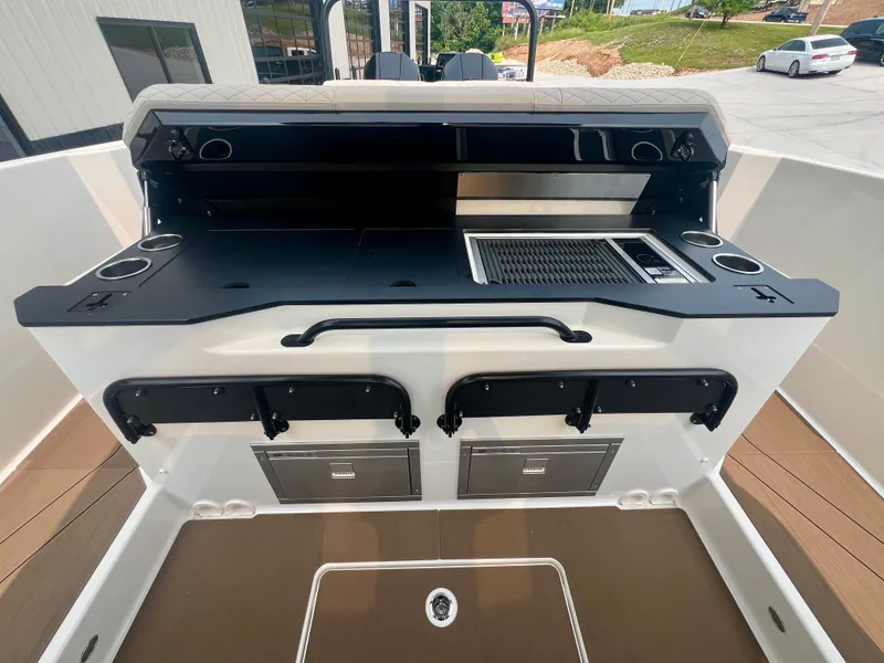 Slide: The Image of Navan S-30 2025 boat interior with sleek kitchen setup and modern amenities. - 19