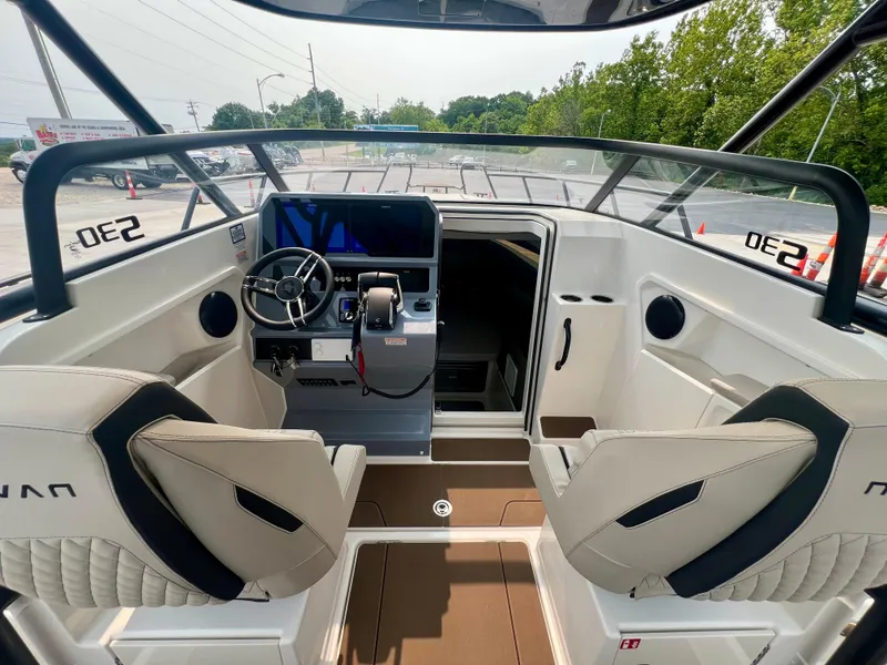 Slide: The Image of Interior of 2025 Navan S-30 boat with modern helm and seating. - 23