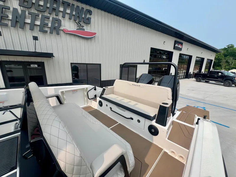 Slide: The Image of 2025 Navan S-30 boat at dealership, showcasing seating and interior design. - 25