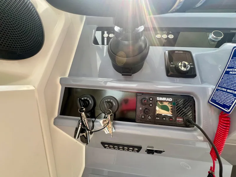 Slide: The Image of Control panel of 2025 Navan S-30 boat with keys and electronic display. - 30