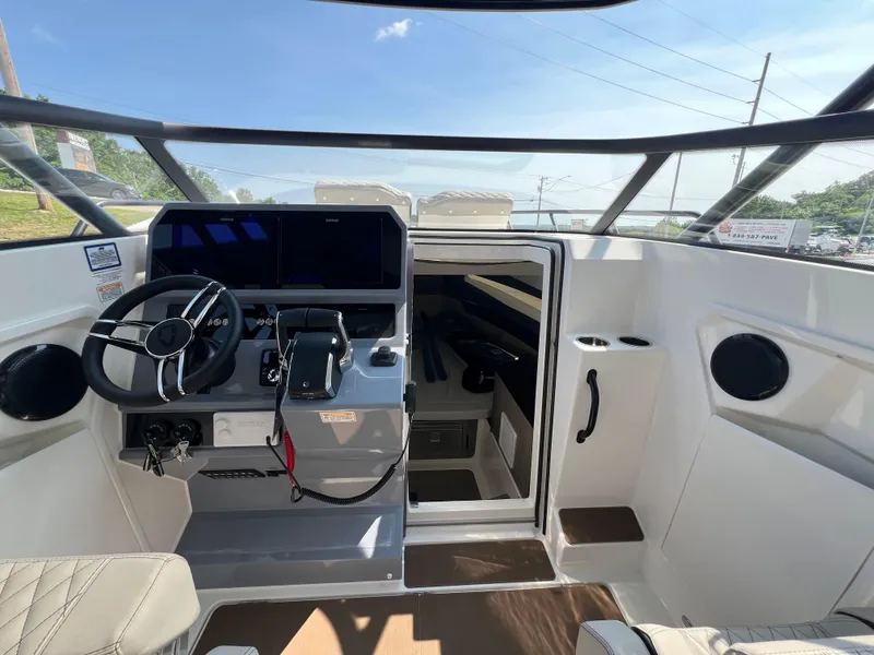 Slide: The Image of Interior view of 2025 Navan S-30 boat cockpit with modern steering and controls. - 33