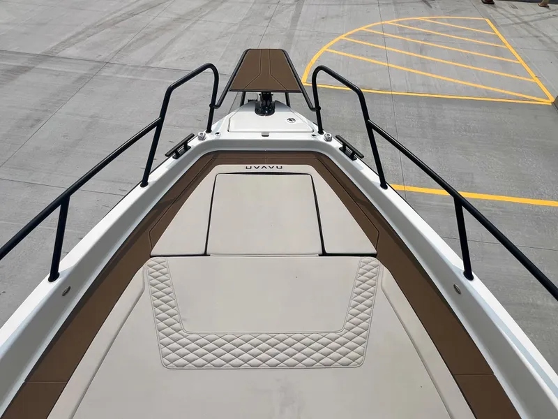 Slide: The Image of Bow view of 2025 Navan S-30 boat with sleek design and cushioned deck. - 44