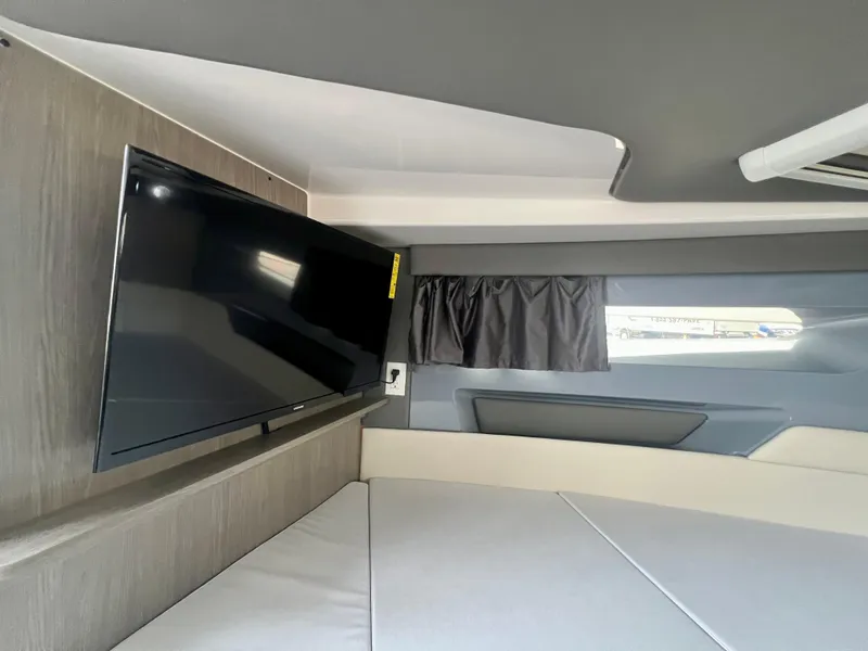 Slide: The Image of Interior of 2025 Navan S-30 with TV, modern design, and comfortable seating. - 47