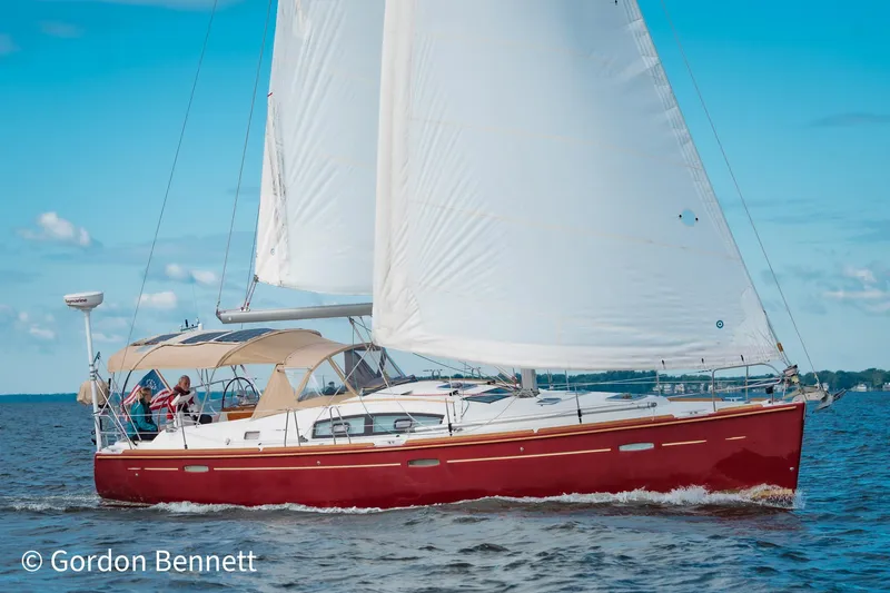 Slide: The Image of Sailing yacht Beneteau Oceanis 43, 2008 model, with red hull on open water. - 5