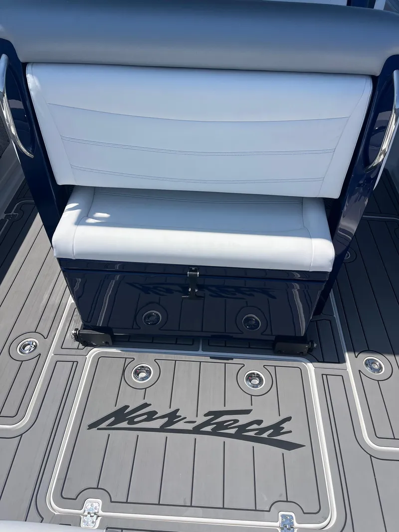 Slide: The Image of 2024 Nor-Tech 390 Sport Center Console, featuring sleek seating and branded flooring. - 16