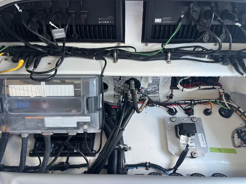 Slide: The Image of Electrical system of 2024 Nor-Tech 390 Sport Center Console boat, showcasing wiring and components. - 22