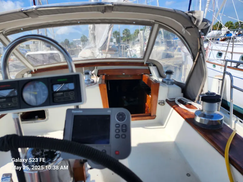 Slide: The Image of Cockpit of 1989 Valiant 40 Cutter sailboat with navigation equipment and winches. - 25