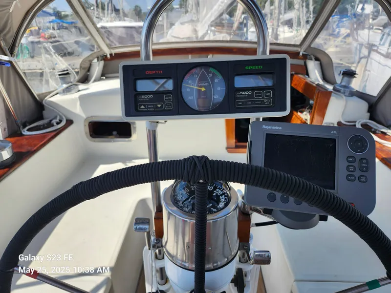 Slide: The Image of Cockpit of 1989 Valiant 40 Cutter with navigation instruments and steering wheel. - 27