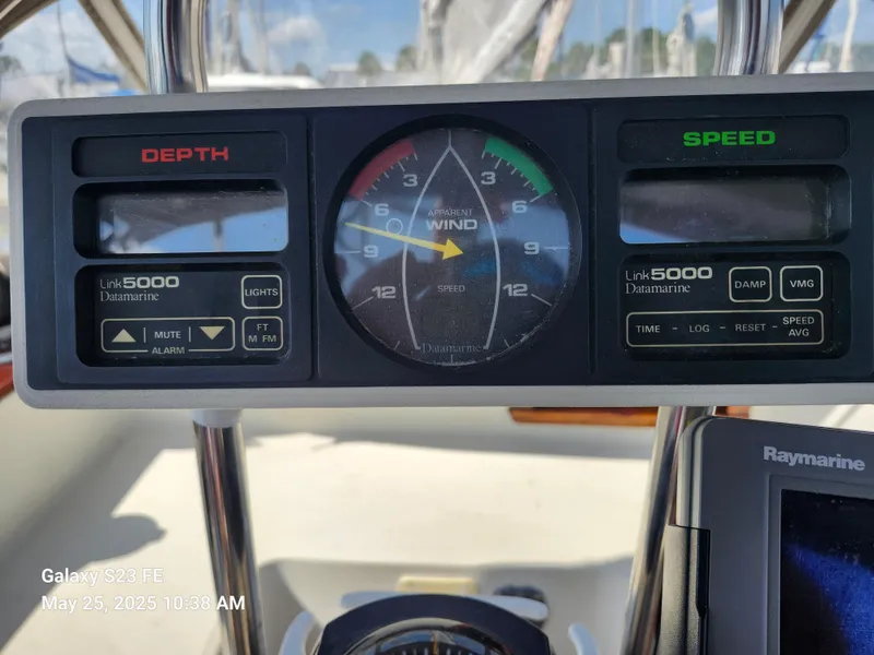 Slide: The Image of Cockpit instrument panel on a 1989 Valiant 40 Cutter sailboat, displaying depth and speed. - 28
