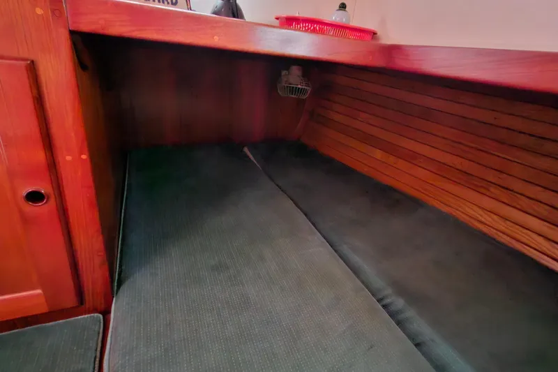 Slide: The Image of Cozy cabin interior of 1989 Valiant 40 Cutter sailboat with wooden finish. - 37