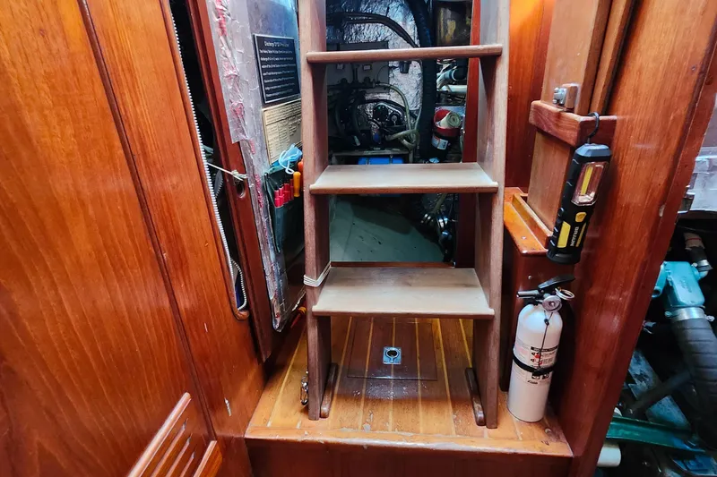 Slide: The Image of Interior of 1989 Valiant 40 Cutter with wooden steps and safety equipment. - 40