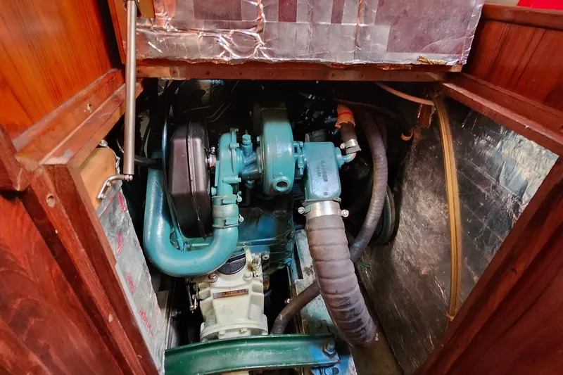 Slide: The Image of Engine compartment of a 1989 Valiant 40 Cutter sailboat, showcasing mechanical components. - 46