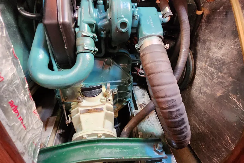 Slide: The Image of Engine compartment of a 1989 Valiant 40 Cutter sailboat, showcasing mechanical components. - 47