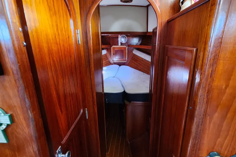 Slide: The Image of Interior of 1989 Valiant 40 Cutter sailboat with wooden finish and cozy cabin. - 49