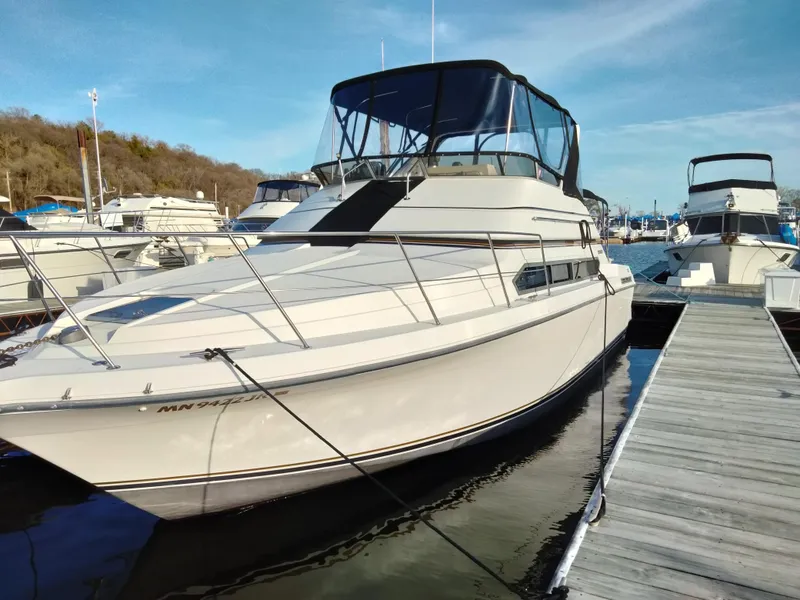 Slide: The Image of 1994 Carver 380 Santego yacht docked at marina under clear blue sky. - 2