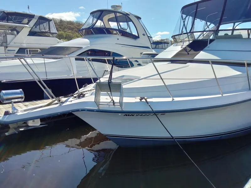 Slide: The Image of 1994 Carver 380 Santego yacht docked at marina, sunny day, clear sky. - 3