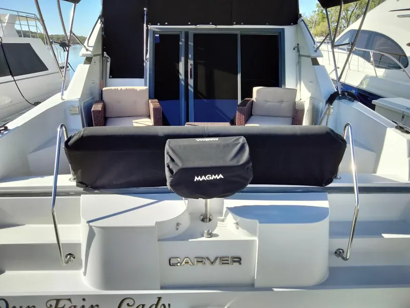 Slide: The Image of 1994 Carver 380 Santego yacht with outdoor seating and covered grill. - 7