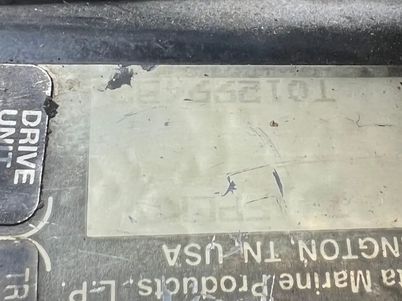 Slide: The Image of Close-up of a worn label on a 1997 Chris-Craft 26 Crowne Cruiser. - 18