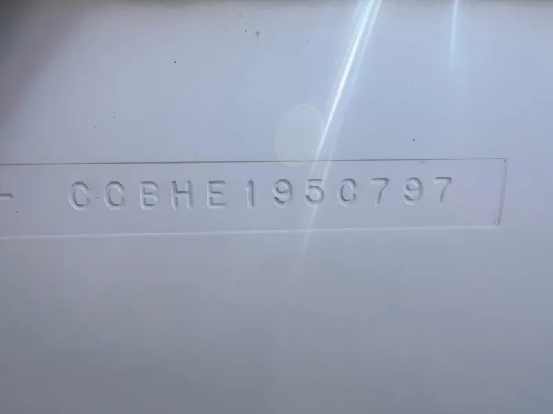 Slide: The Image of 1997 Chris-Craft 26 Crowne Cruiser hull identification number (HIN) embossed on white surface. - 19