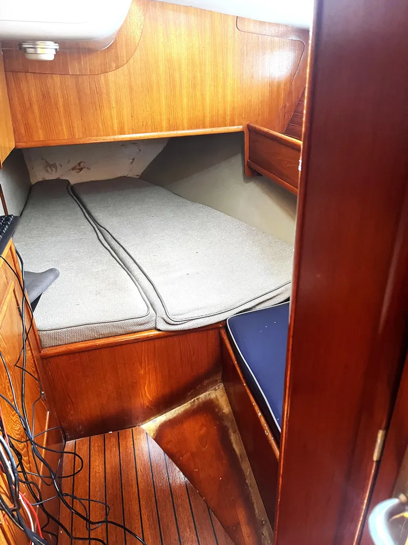Slide: The Image of Cozy cabin interior of 1990 Jeanneau Sun Magic 44 sailboat with wooden finish. - 13