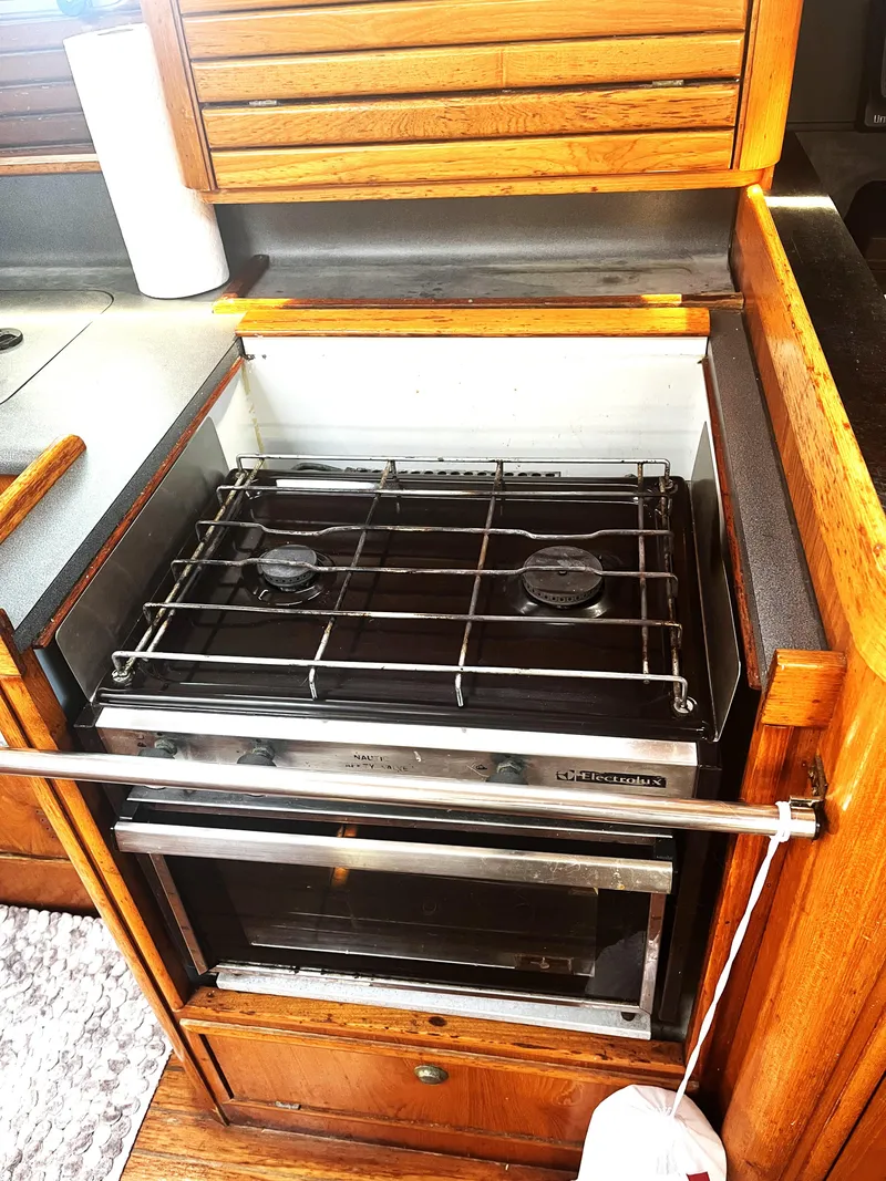 Slide: The Image of Galley kitchen with stove in 1990 Jeanneau Sun Magic 44 sailboat. - 5