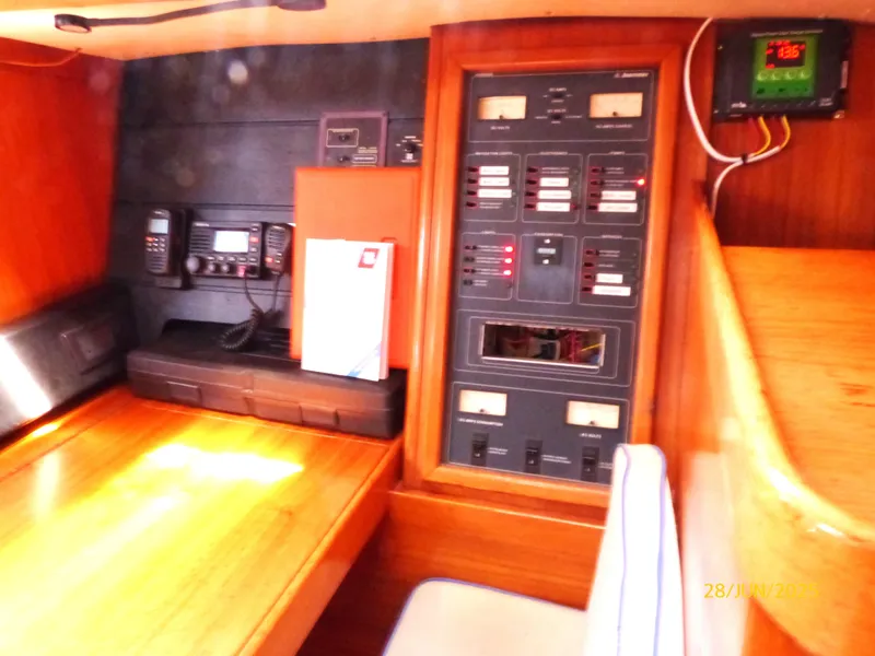 Slide: The Image of Interior of 1990 Jeanneau Sun Magic 44 yacht with navigation equipment and control panel. - 8