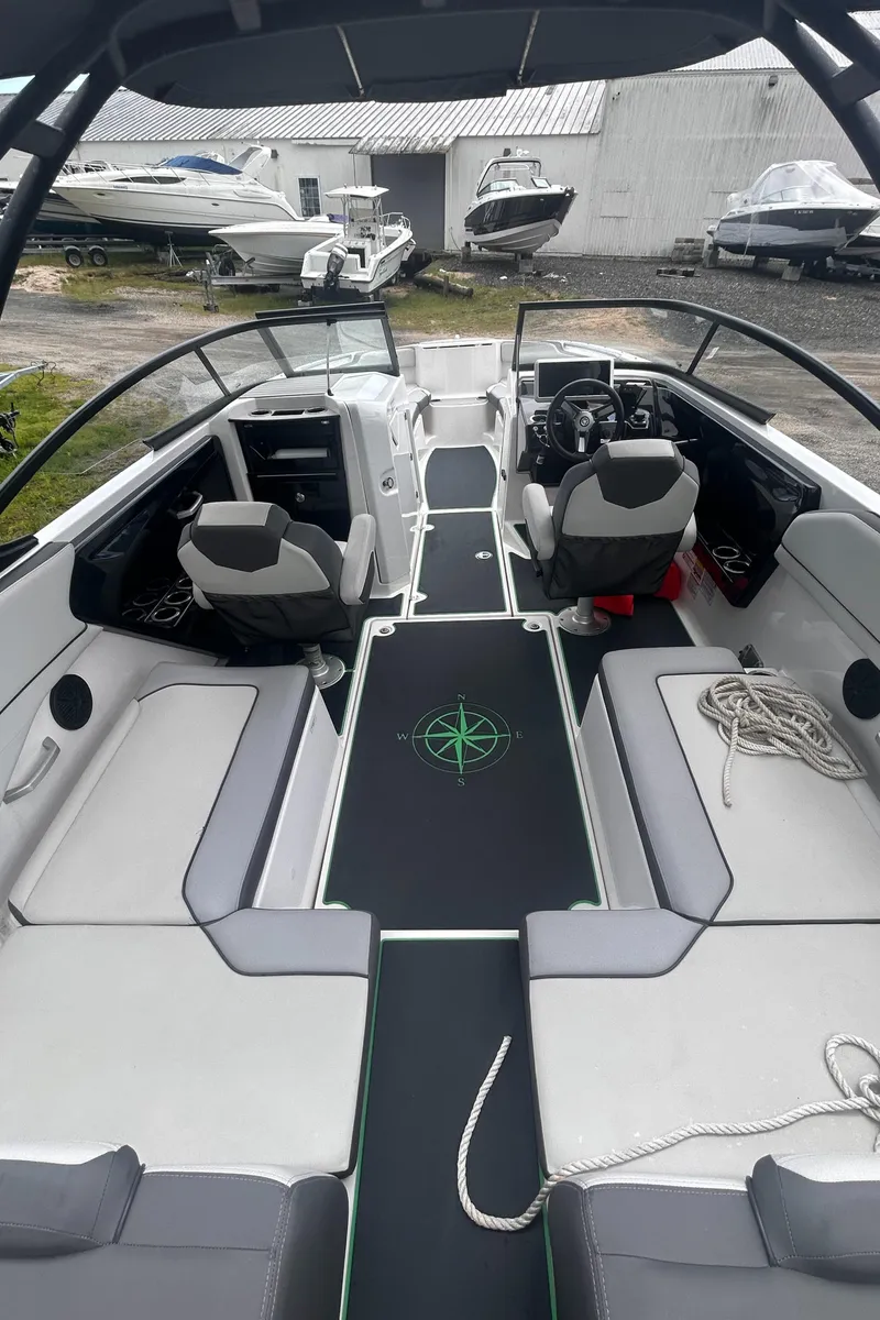 Slide: The Image of 2021 Yamaha Boats AR250 interior with modern seating and sleek design. - 7