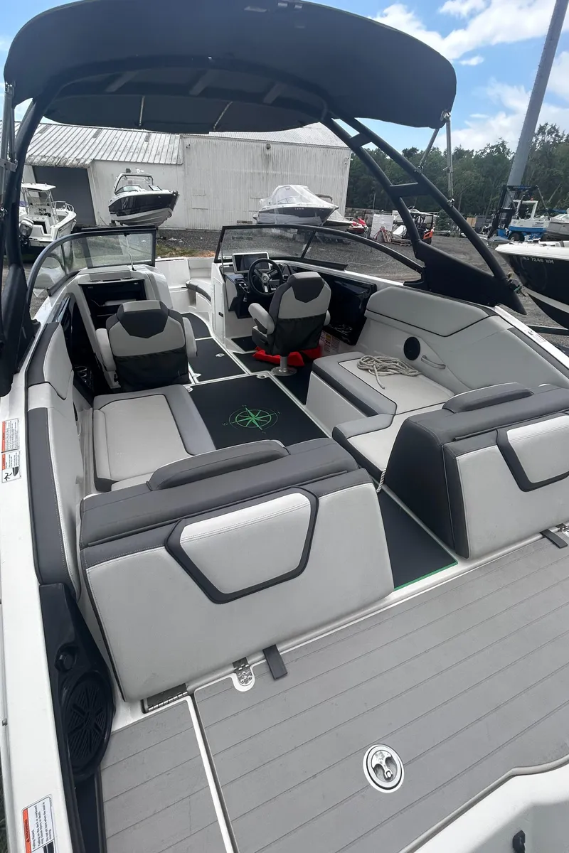 Slide: The Image of 2021 Yamaha Boats AR250 interior with sleek seating and modern design. - 8