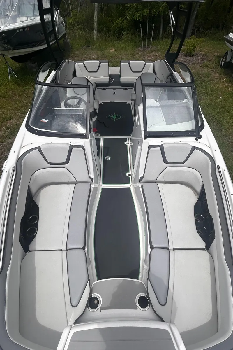 Slide: The Image of 2021 Yamaha Boats AR250 interior with sleek seating and modern design. - 9